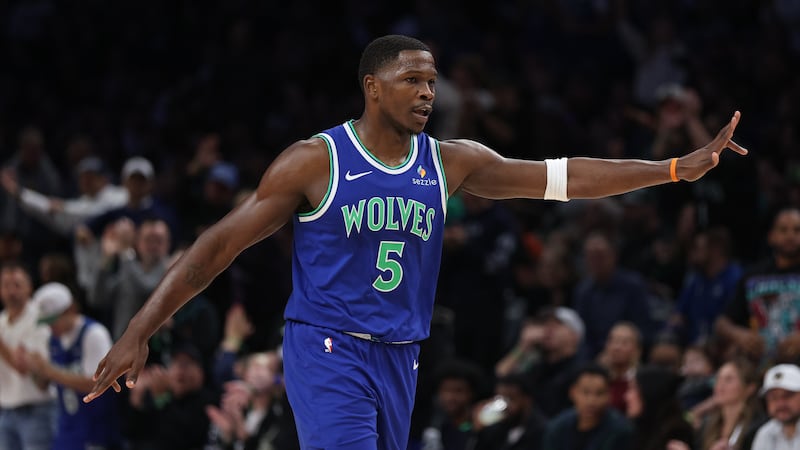 Minnesota Timberwolves guard Anthony Edwards celebrates scoring during the first half of an...