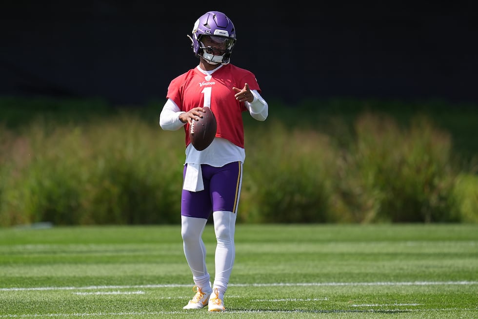 Minnesota Vikings quarterback Kyler Murray stands on the field during the NFL football team's...