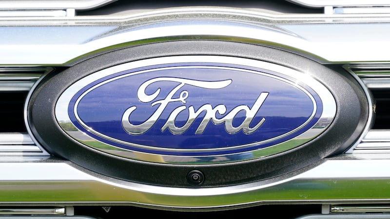 FILE - A logo on a vehicle at a Ford dealership in Springfield, Pa., Tuesday, April 26, 2022.