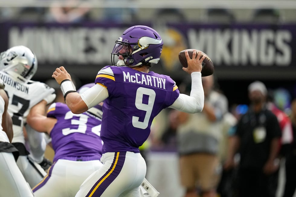 Minnesota Vikings quarterback J.J. McCarthy (9) throws a pass during the first half of an NFL...