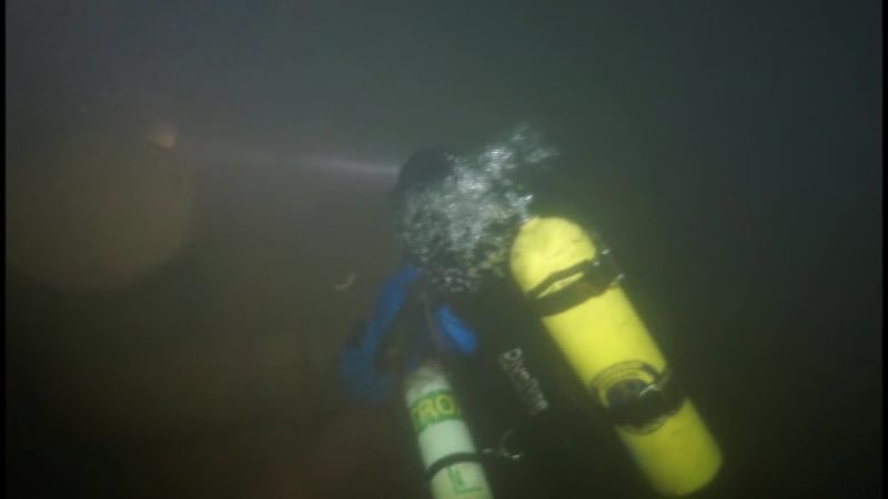 Divers with the Great Lakes Shipwreck Preservation Society keep an eye on the whaleback Thomas...
