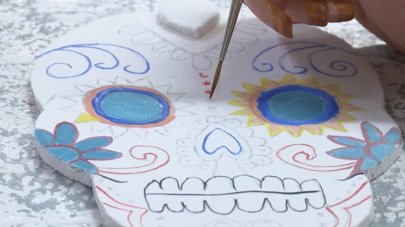 Superior stained-glass shop hosting sugar skull painting workshop for Halloween